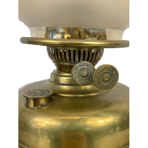 323 - An Edwardian brass oil lamp. 57cm.