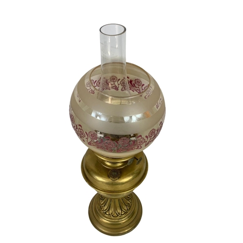 323 - An Edwardian brass oil lamp. 57cm.