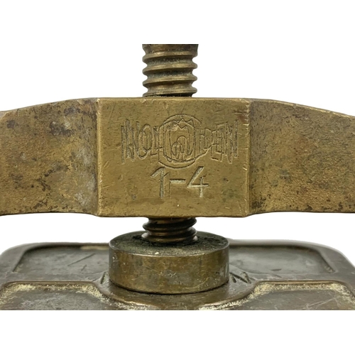 324a - An early 20th century bronze dental press. 11 x 15cm.