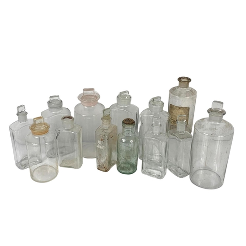 324c - 13 Edwardian period chemist jars. Largest 25cm.