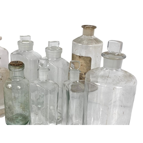 324c - 13 Edwardian period chemist jars. Largest 25cm.