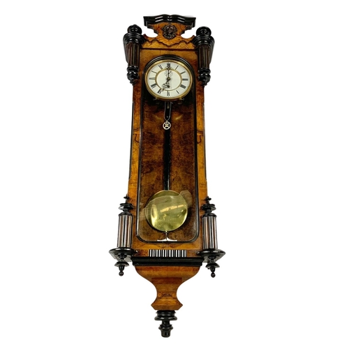 324k - A large Victorian walnut Vienna wall clock. With weight, pendulum and key. 116cm