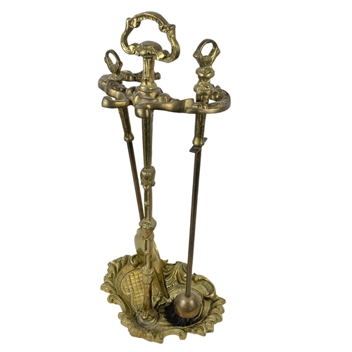 376 - A tall vintage brass companion set in the 18th century style and a vintage brass coal bucket. Compan... 