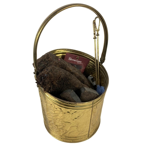 376 - A tall vintage brass companion set in the 18th century style and a vintage brass coal bucket. Compan... 