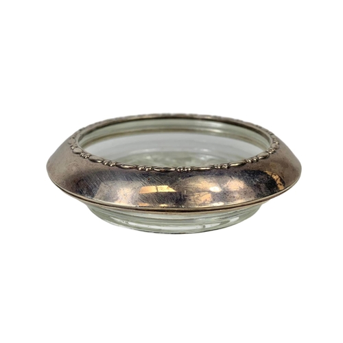 683 - A silver rimmed ashtray. 10cm.