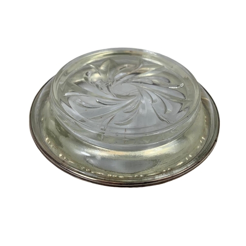 683 - A silver rimmed ashtray. 10cm.