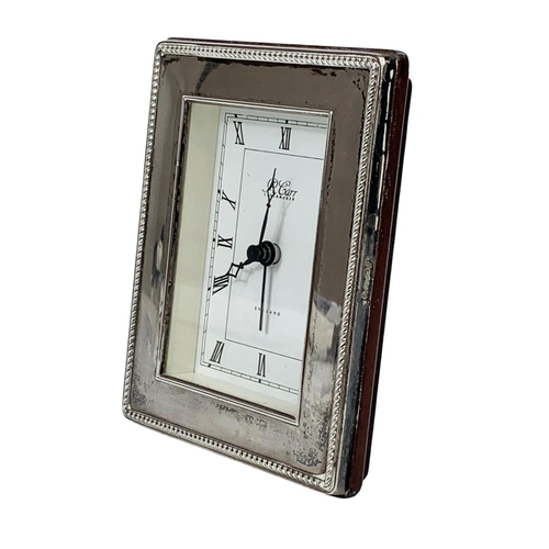 684 - A silver framed clock. R. Carr Clockmaker. 9.5 x 12cm.