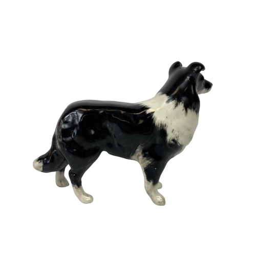 748 - 3 Beswick pottery dogs. Largest 19cm