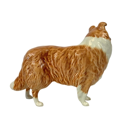 748 - 3 Beswick pottery dogs. Largest 19cm