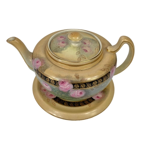 749 - An early 20th century Windsor Art Ware Gibson & Sons LTD teapot on stand. Number 6446. 22 x 11cm.