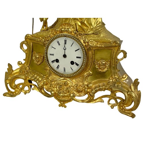 112a - A 19th century French ormolu gilt mantle clock. With key and pendulum. Circa 1870. 35 x 36cm