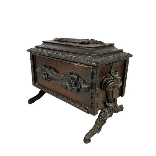 324t - A large 19th century Black Forest carved oak tea caddy. Circa 1870/1880. 38 x 26 x 29cm.