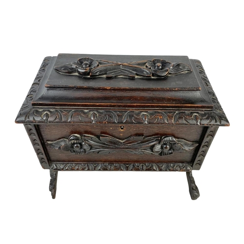 324t - A large 19th century Black Forest carved oak tea caddy. Circa 1870/1880. 38 x 26 x 29cm.