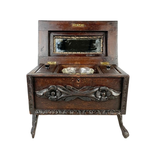 324t - A large 19th century Black Forest carved oak tea caddy. Circa 1870/1880. 38 x 26 x 29cm.