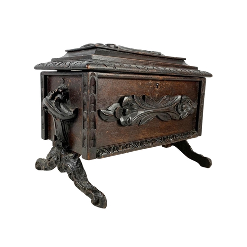 324t - A large 19th century Black Forest carved oak tea caddy. Circa 1870/1880. 38 x 26 x 29cm.