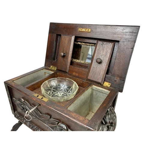 324t - A large 19th century Black Forest carved oak tea caddy. Circa 1870/1880. 38 x 26 x 29cm.