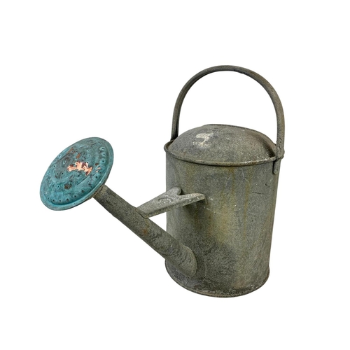 377 - A vintage galvanised watering can. 57 x 43cm.