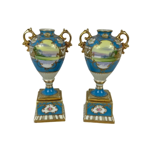 501g - A pair of early 20th century Noritake hand painted gilt porcelain urns. Circa 1908. 19cm.