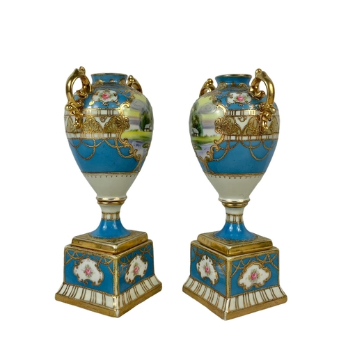 501g - A pair of early 20th century Noritake hand painted gilt porcelain urns. Circa 1908. 19cm.