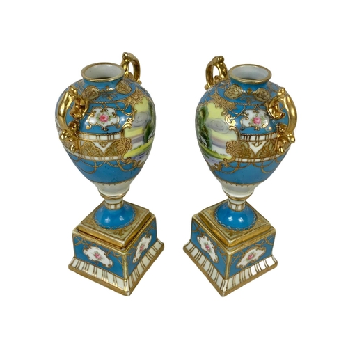 501g - A pair of early 20th century Noritake hand painted gilt porcelain urns. Circa 1908. 19cm.