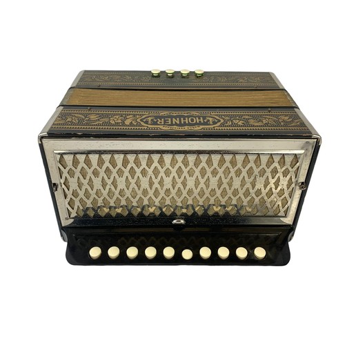 160d - A vintage Hohner pokerwork accordion 28 x 24 x 15cm when closed.