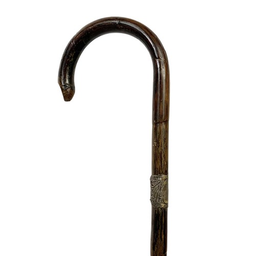 160N - 3 Victorian walking sticks. 2 silver mounted and 1 brass with carved walnut tip largest 92cm.