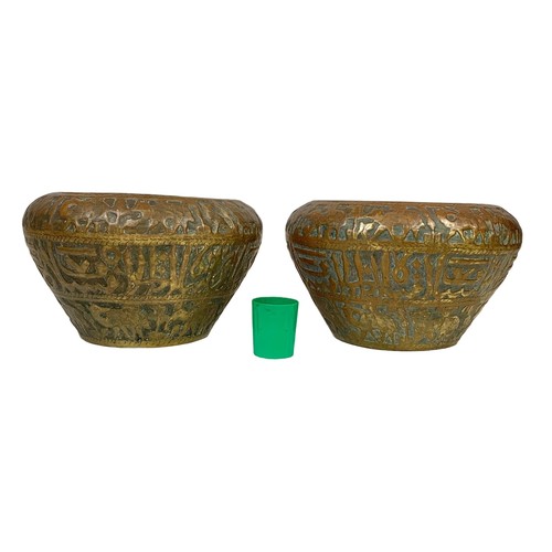 42b - A pair of large mid 19th century Persian brass planters with decoration describing the “Middle Easte... 