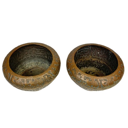 42b - A pair of large mid 19th century Persian brass planters with decoration describing the “Middle Easte... 