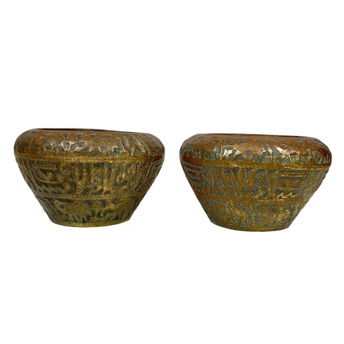 42b - A pair of large mid 19th century Persian brass planters with decoration describing the “Middle Easte... 