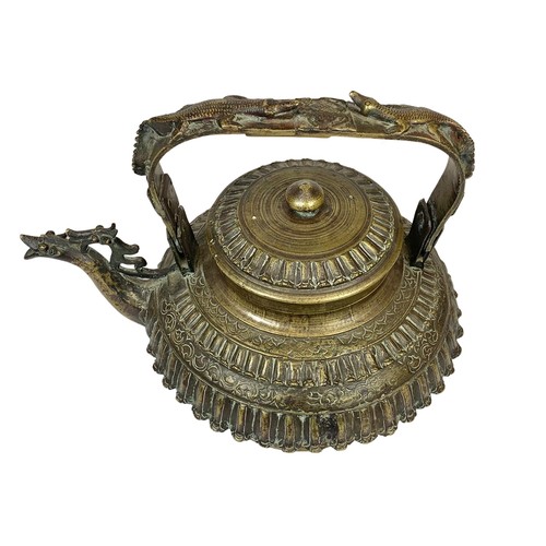 42c - A large 19th century heavy ornate heavy brass Middle Eastern kettle decorated with mythical dragons ... 