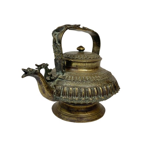 42c - A large 19th century heavy ornate heavy brass Middle Eastern kettle decorated with mythical dragons ... 