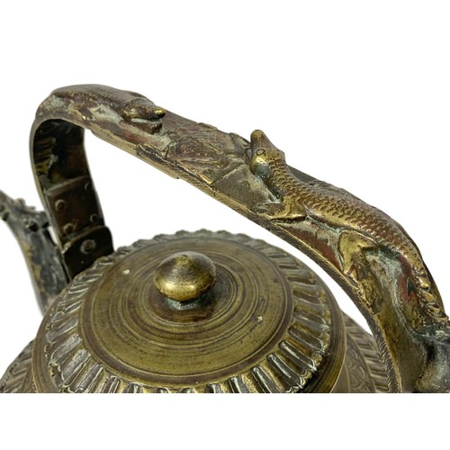 42c - A large 19th century heavy ornate heavy brass Middle Eastern kettle decorated with mythical dragons ... 