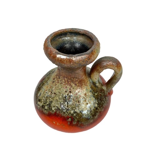 405c - A West German salt glazed pot with handle. 12 x 14cm.