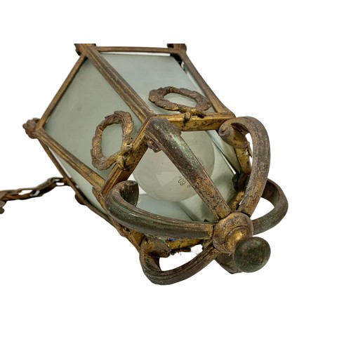 45f - An early 20th century ornate gilt brass hall or porch light fitting. Circa 1900/1920. 73cm including... 