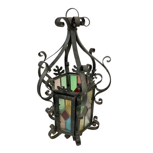 45g - A vintage wrought iron light fitting with stain glass. 29 x 60cm.