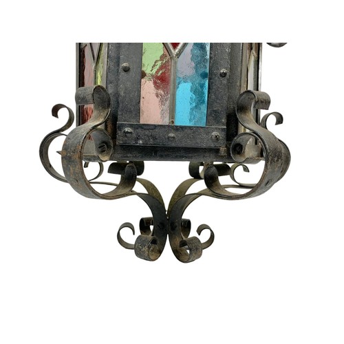 45g - A vintage wrought iron light fitting with stain glass. 29 x 60cm.