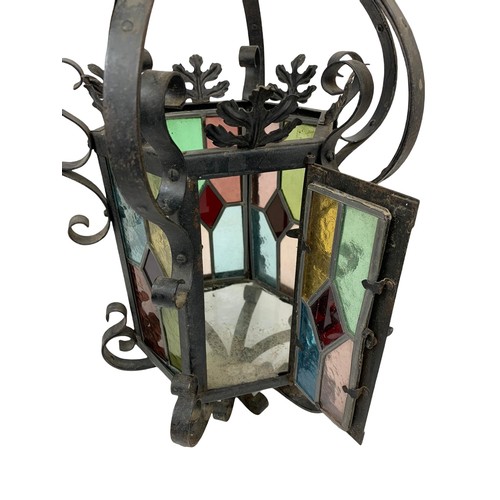 45g - A vintage wrought iron light fitting with stain glass. 29 x 60cm.