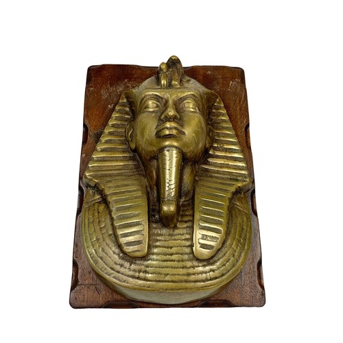 70a - A large 1930’s heavy brass plaque of Tutankhamun on a mahogany frame. 22.5 x 33cm.