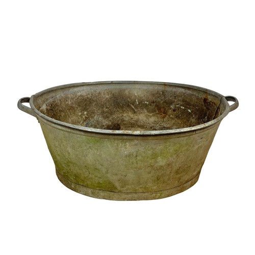 75i - A large early 20th century galvanised tub. Circa 1930. 82 x 59.5 x 31cm.