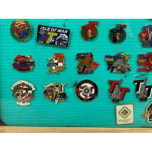 268c - A collection of framed TT racing badges. Frame measures 36 x 36cm