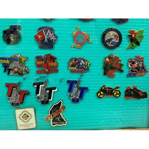 268c - A collection of framed TT racing badges. Frame measures 36 x 36cm