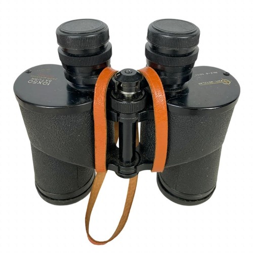 268x - A pair of Wetzlar binoculars with military body armour and helmet.