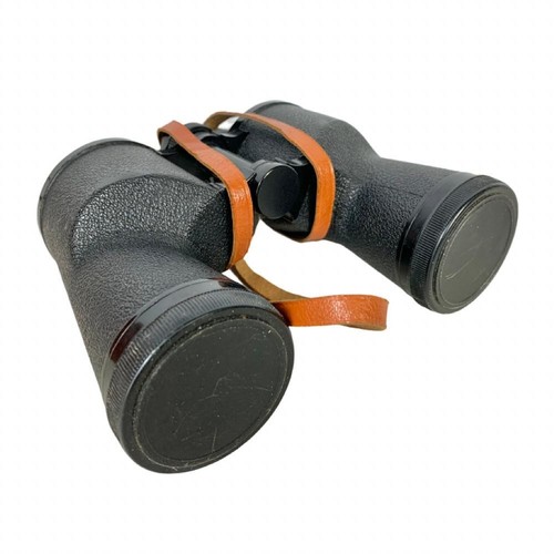 268x - A pair of Wetzlar binoculars with military body armour and helmet.