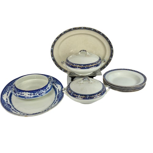 534b - Quantity of early 20th century blue and white pottery dinnerware. Largest platter 46 x 37cm