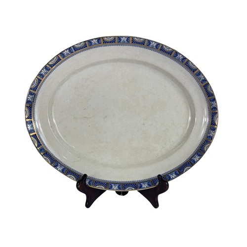 534b - Quantity of early 20th century blue and white pottery dinnerware. Largest platter 46 x 37cm