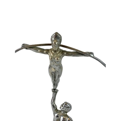 323b - Vintage balancing ornament depicting acrobats. 31 x 27cm