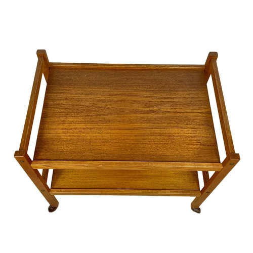 948 - A Danish teak 2 tier serving trolley by BRDR Furbo. Mid century. Circa 1960’s. 71 x 46 x 63.5cm.