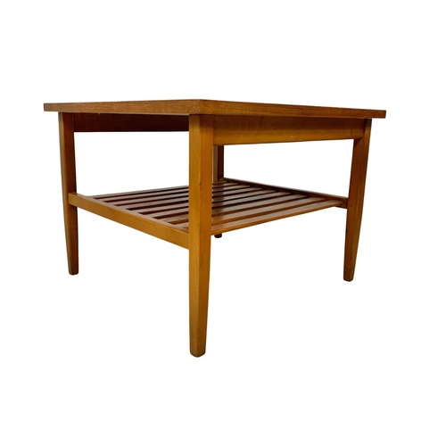 1043 - Teak 2 tier side table. Mid century. Circa 1970. 51 x 51 x 38cm.