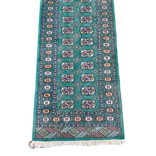 928a - A large vintage Middle Eastern runner rug. 80 x 496cm