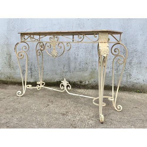 1026 - A large vintage ornate marble top console table on an wrought iron base. 142 x 46 x 90cm